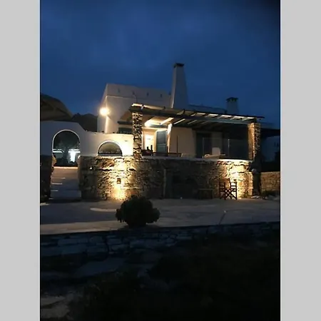 Beach House By The Setting Sun